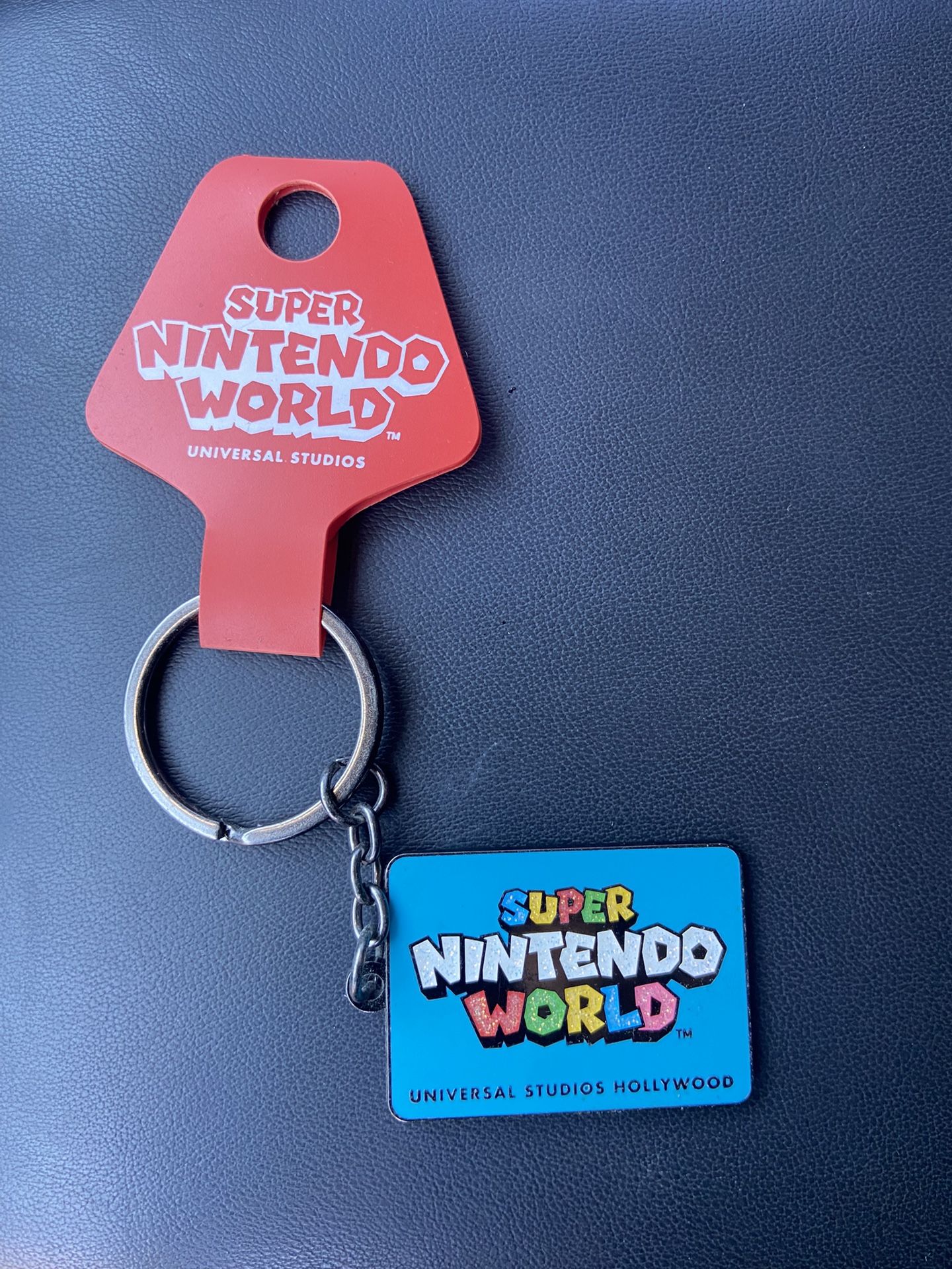 Two Super Nintendo World Keychain