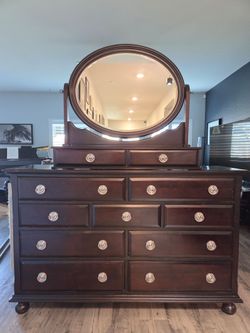 Dark Wood Dresser with Oval Mirror