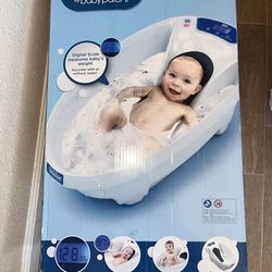 Baby weight and thermometer tub