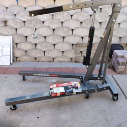 Engine hoist, leveler and stand
