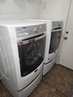Washer and dryer with pedestals may tag