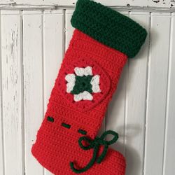 Vintage handmade crocheted red granny square patch Christmas stocking with green cuff.  12” long. Loop for hanging