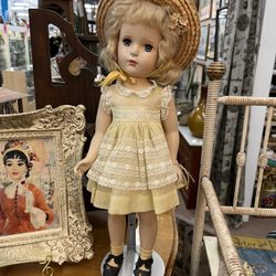 Vintage Doll With Yellow Dress And Stand