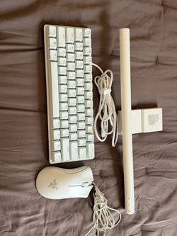 Razer Huntsman mini keyboard, razer deathadder essential mouse, and monitor light bar,