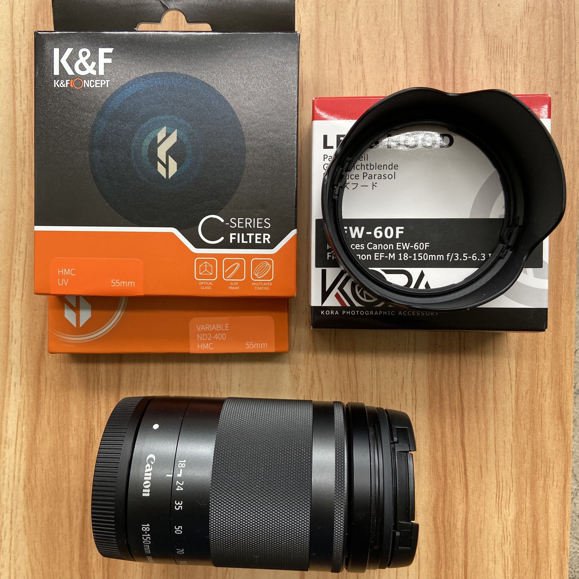 Canon Lens Bundle: Lens EF-M 18-150mm IS STM. Includes Filters And Hood. Excellent Like New Condition.