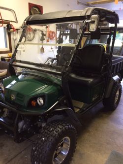 Cushman side by side this now has enclosed cab and has turn signals radio it is road roadworthy