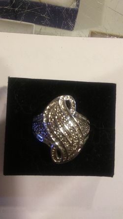 Diamond cluster ring set in Silver with Platinum overlay.