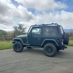 Jeep Wrangler TJ With Roof Rack Tires