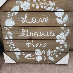 Love Grows Here sign