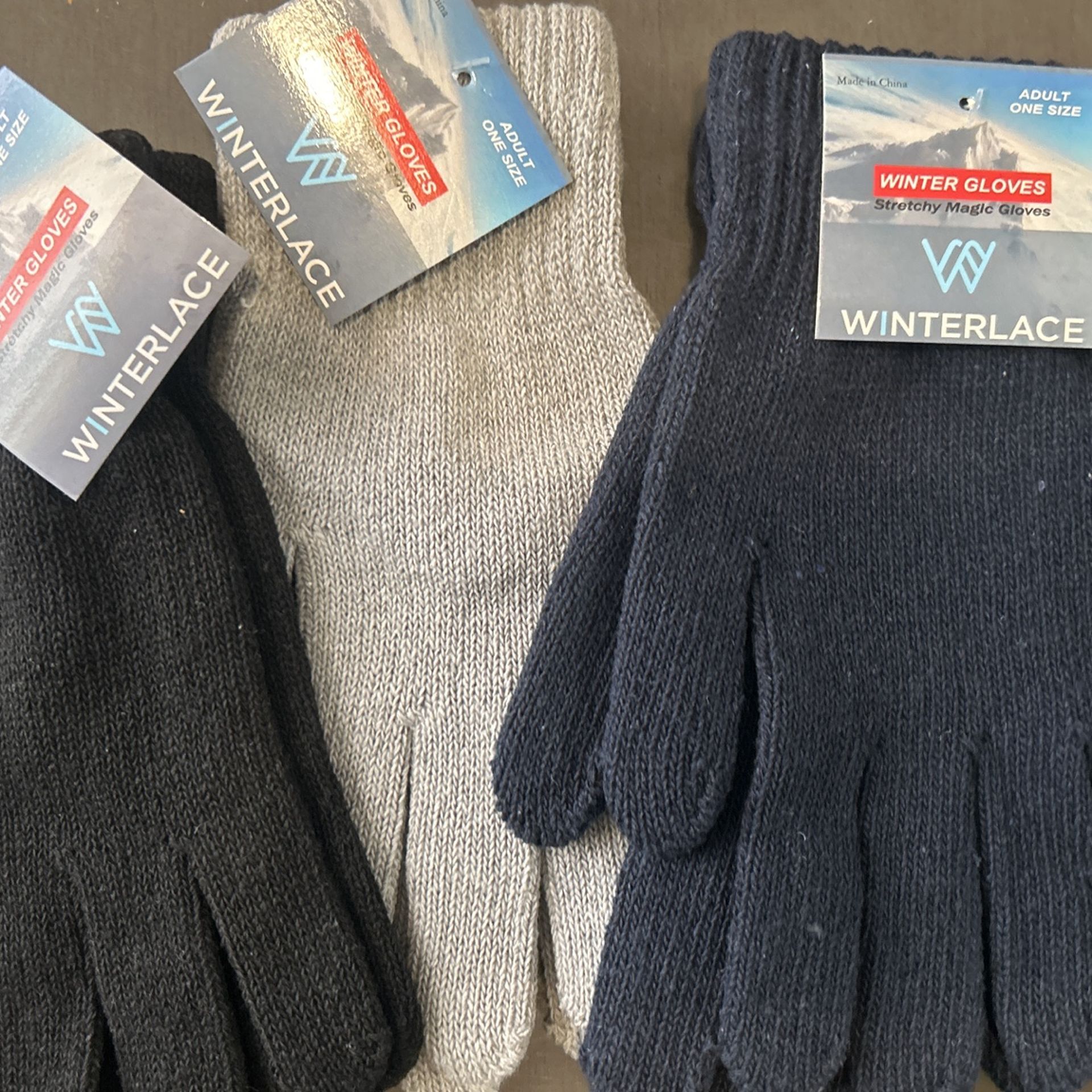 Three pairs of gloves, brand new one size fits all adult size