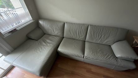 MOVING NEED GONE IMMEDIATELY!! Bloomingdales Italian leather 2 piece sectional w/ chaise.