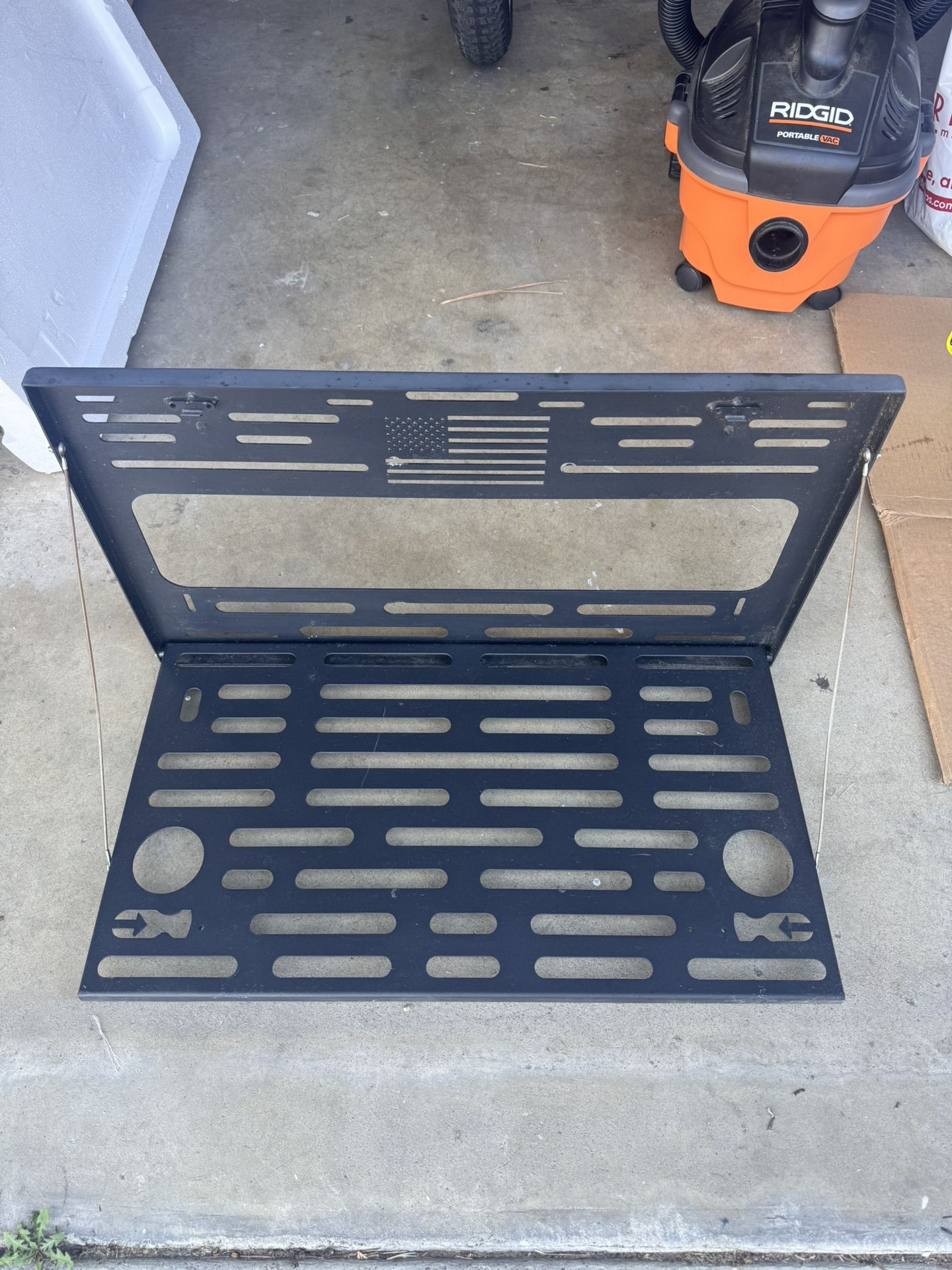 Drop down table for tire swing out or tailgate.
