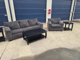 couch and chair with coffee/side tables