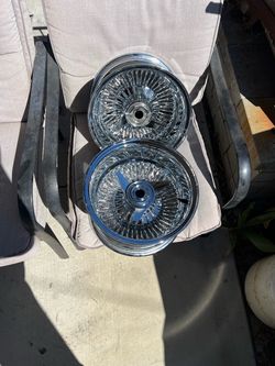 13x7 chrome dayton style wire wheels -like new