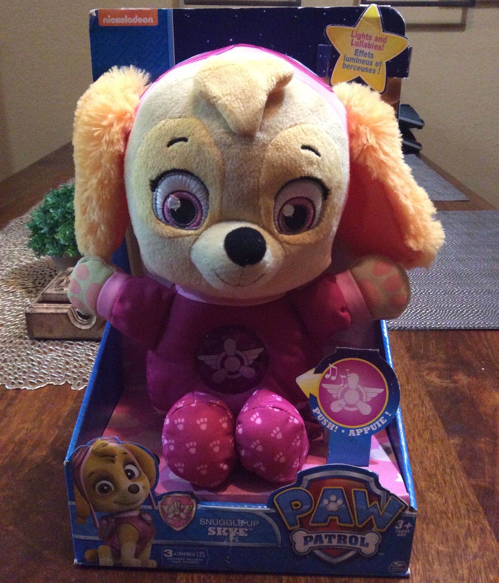 Paw Patrol Skye stuffed animal, sings and lights up. Note it requires new batteries