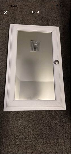 White medicine cabinet with mirror