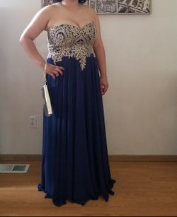 Strapless Navy blue gown with gold corsetted top