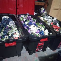 Several Huge Bins On Wheels Of Wedding Decor 
