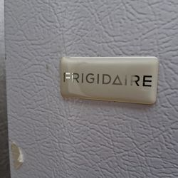 White up right fridgidare refrigerator