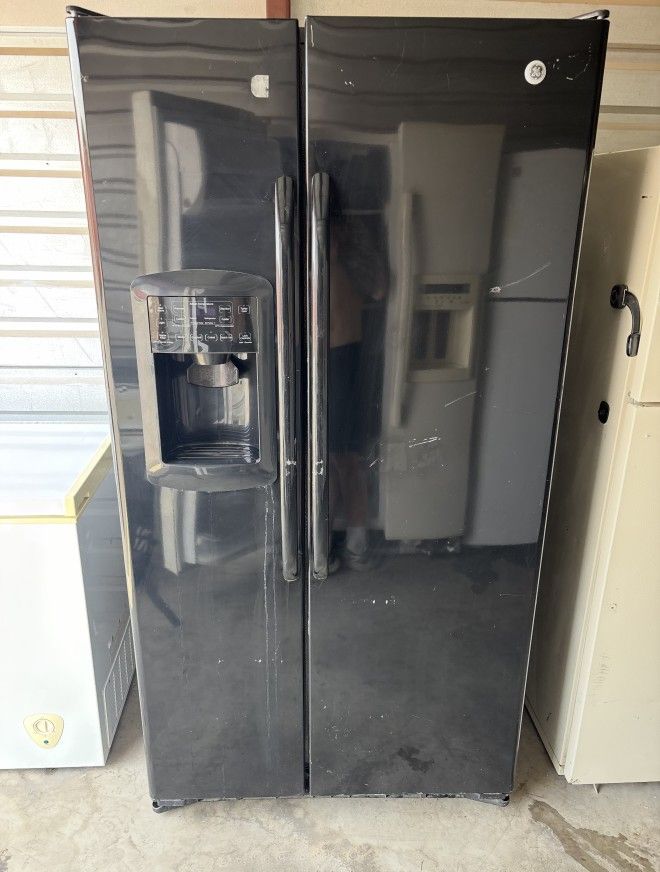 Black GE Refrigerator And Freezer