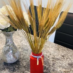 Dried wheat flower with red vase