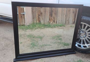 Dark wood framed mirror