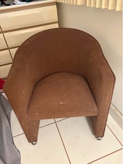 Brown rolling chair
