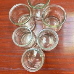 Six Small Glass Containers