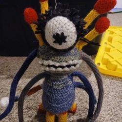 Handcrafted Multi-Color Yarn Featuring and Alien Design.