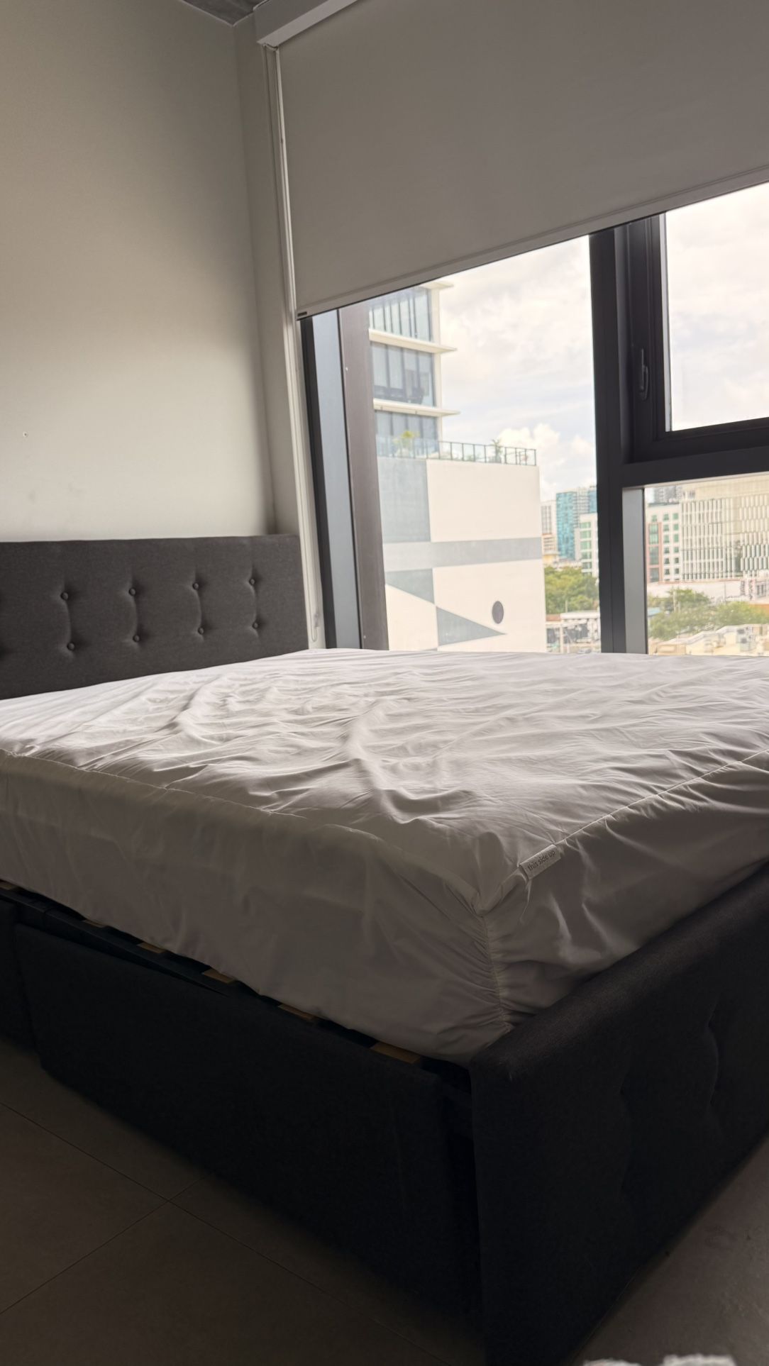 Queen sized bed with frame and has drawers under bed 