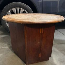 Round End Table With Hexagon Storage Base.