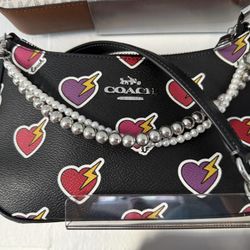 Coach Teri Shoulder Bag with Heart Bolt Print. 