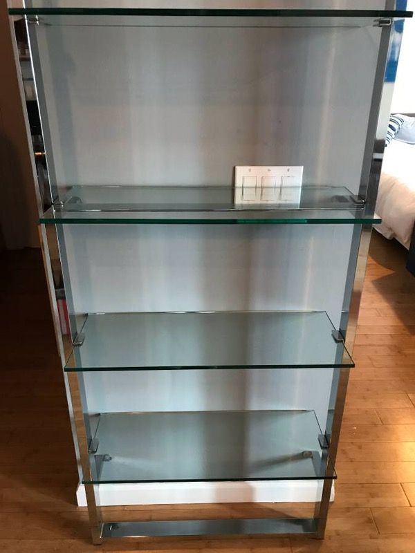 Very sleek Tesso bookshelf from CB2. Chrome with glass shelves.