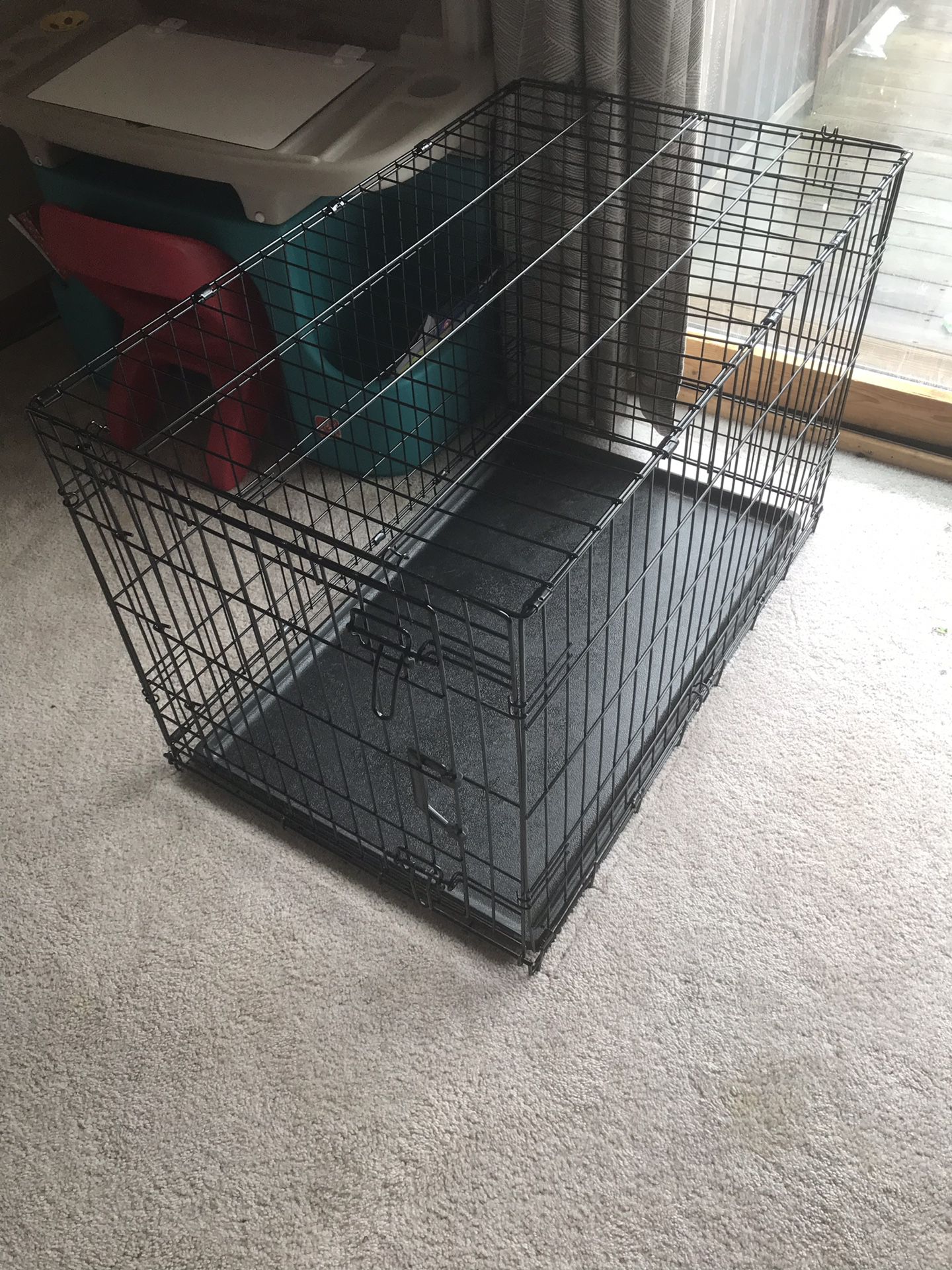 Medium size dog crate with training pads