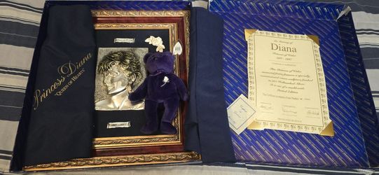 Collectible Princess Diana set. Has a beautiful framed 925 Hallmarked Silver sculpture of Diana. Also comes with a Ty Beanie Baby Princess bear, tags