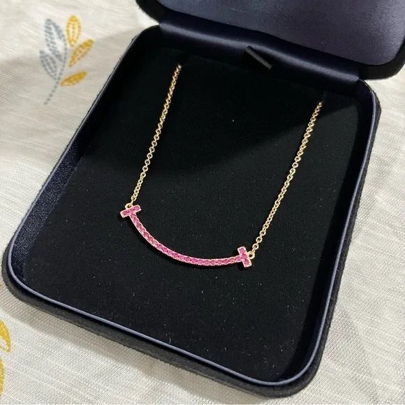 Tillany & Co. Tiffany T Smile Pendant Necklace Pink