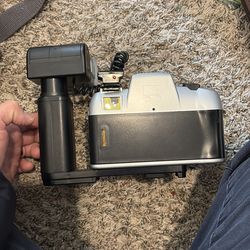 Vintage film camera with flash canon DL-9000