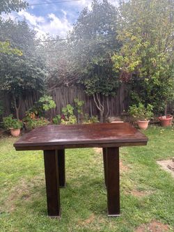 Dark Wood Dining Table with Fluted Legs
