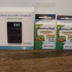 New Camera Charger And 2 Batteries 