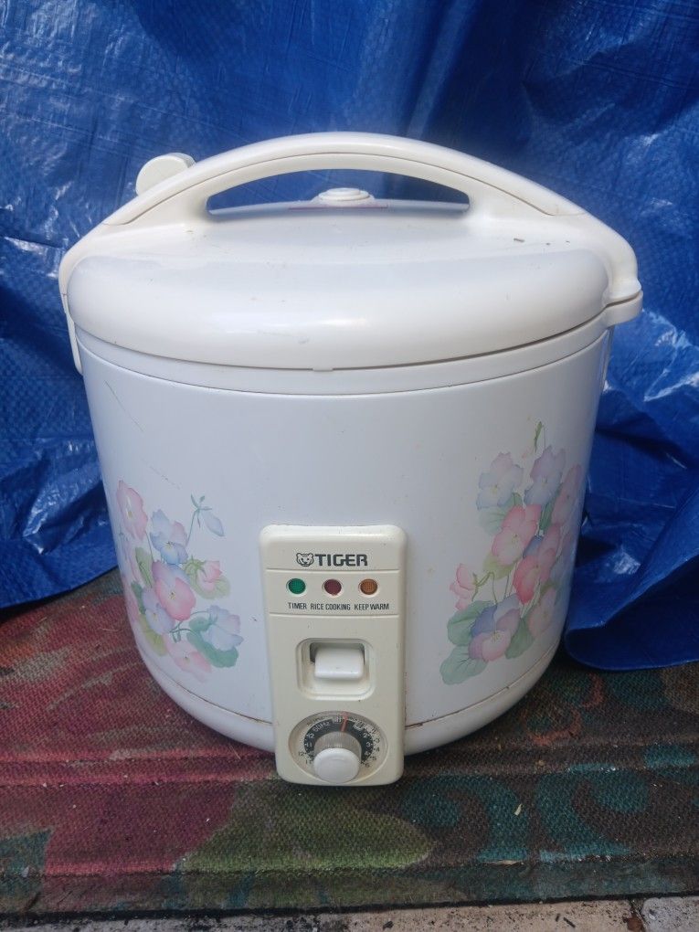 Used Tiger JNP series conventional electric rice cooker and warmer.