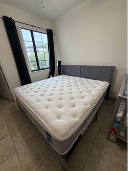 King-size bed with a lightly used mattress; it is almost new.