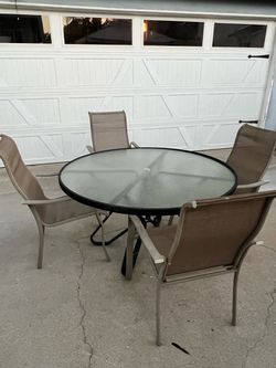 Patio Furniture, glass table & 4 chairs.