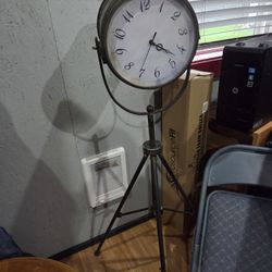 Clock with storage on tripod stand
