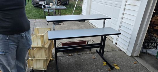 Desk adjustable can be level as one table or two level. As shown