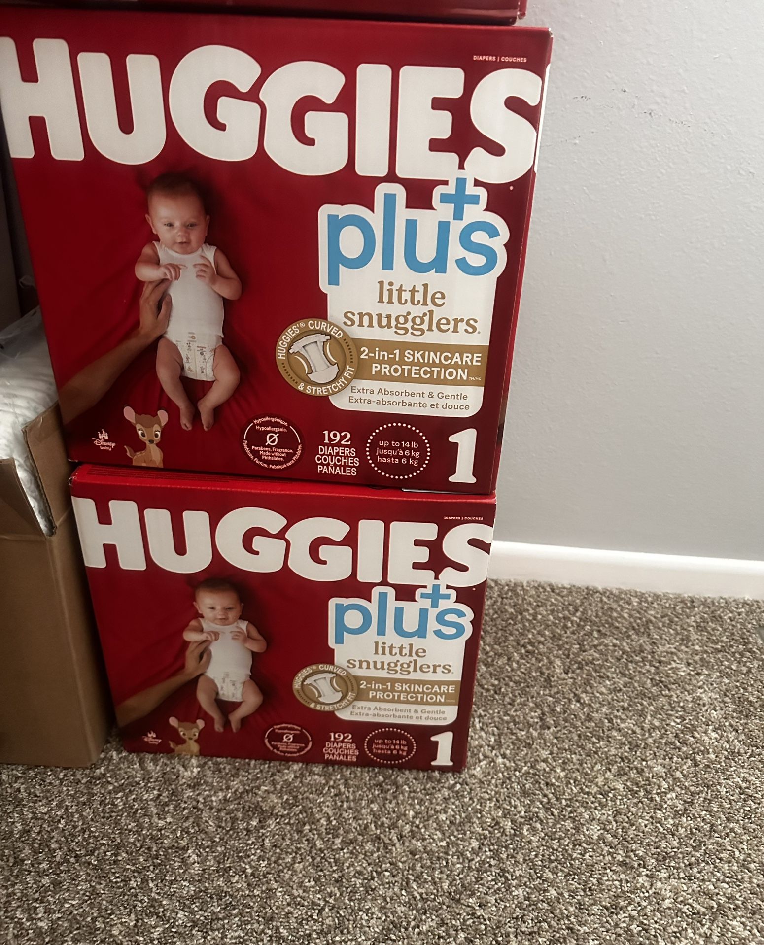 Box with Huggies and Pampers diapers.