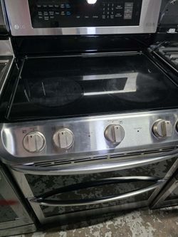 LG 30"wide Smart Thin-Q  flat-top range Electric stove with a double oven.