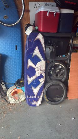 a blue Blindside Blade 142 wakeboard featuring a large skull graphic.