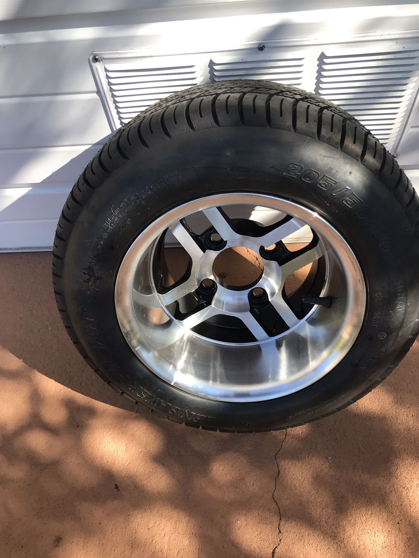 1 golf cart tire and wheel like new. 205-50-10