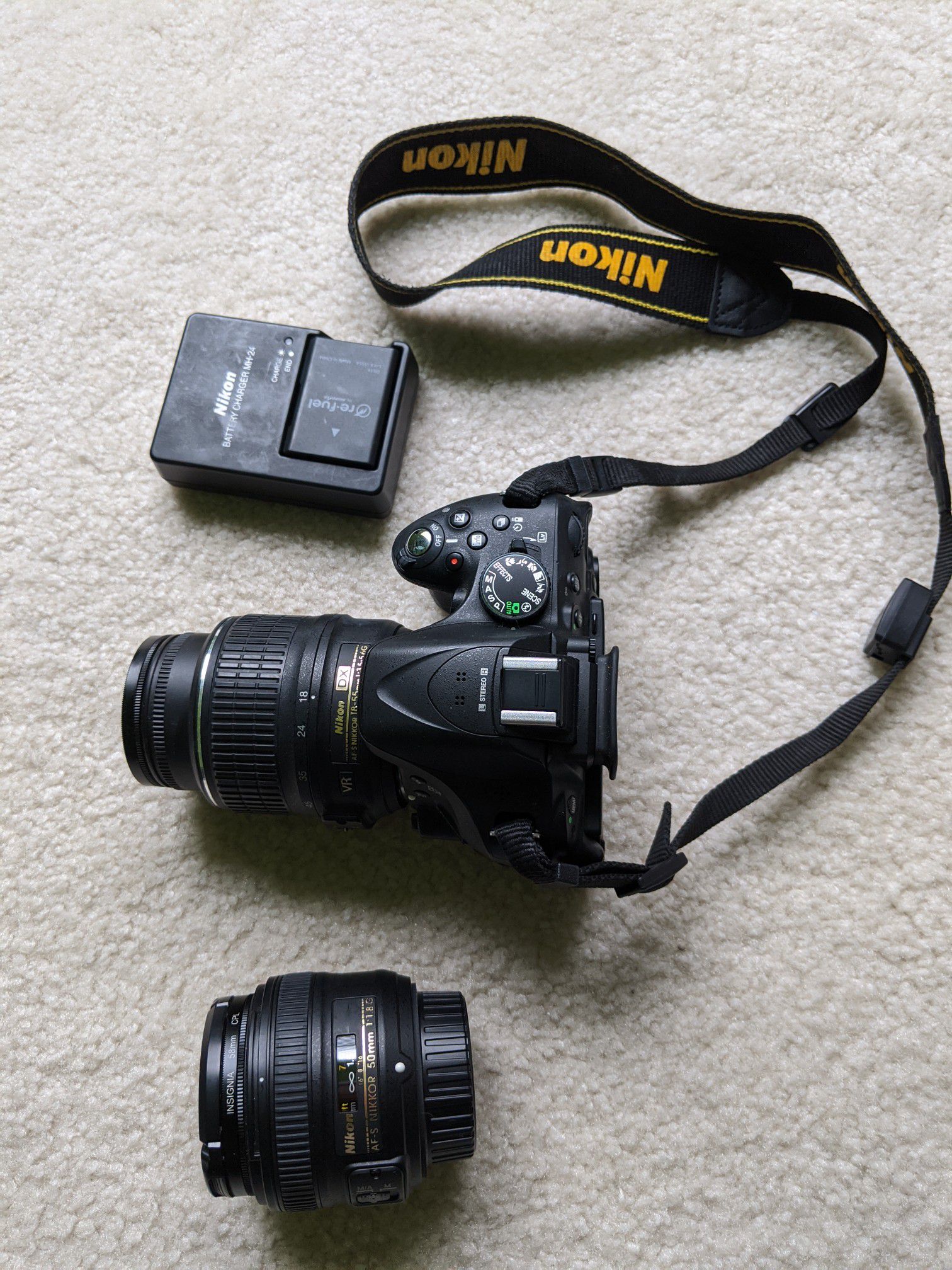 Nikon D5200 with 2 lenses 2 batteries and a bag