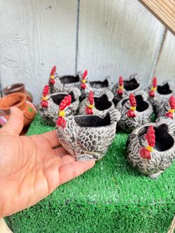cement flowerpots, chicken figurines